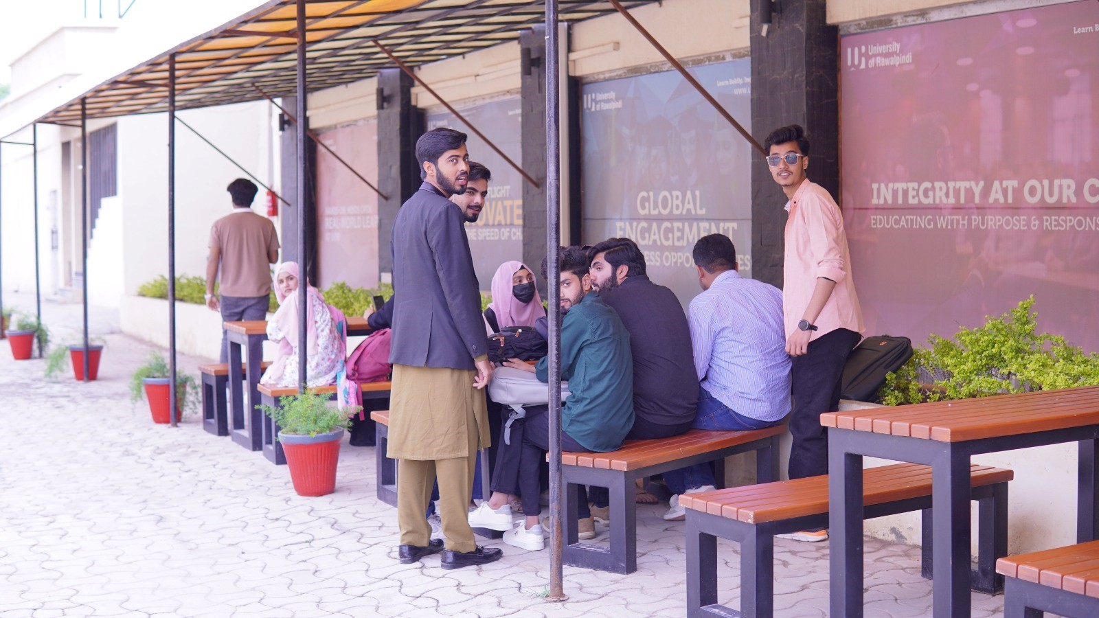 Students interacting in a common area on the UOR campus.